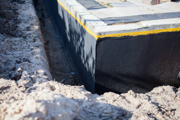 Professional Basement Waterproofing technician working in Carol Stream, IL